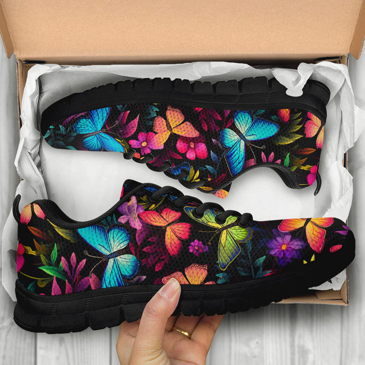 Unboxing Butterflies Sneakers with black soles, showing the shoes held inside a cardboard shoe box.