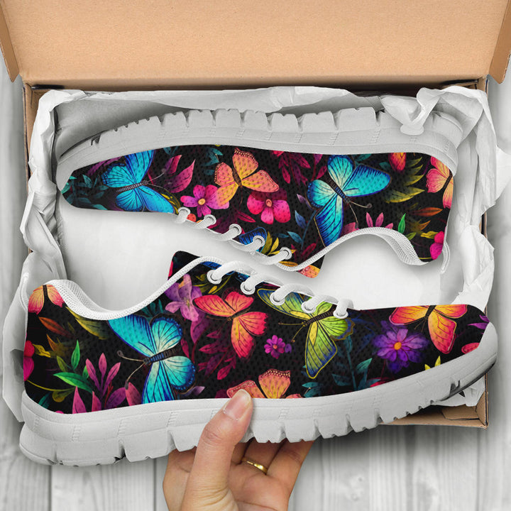 Unboxing Butterflies Sneakers with white soles, showing the vibrant shoes inside a cardboard shoe box.