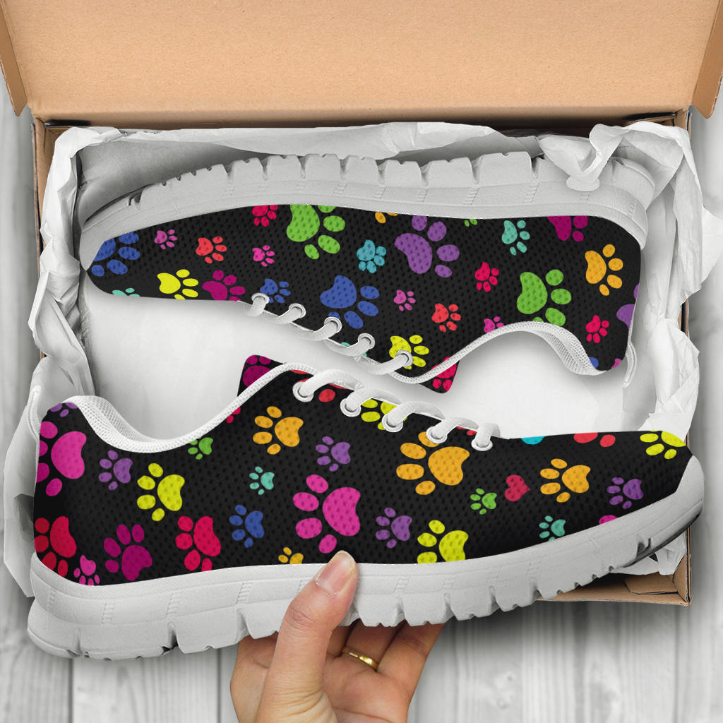 Unboxing Colorful Paws Sneakers with white soles, showing the vibrant colorful shoes inside a cardboard shoe box.
