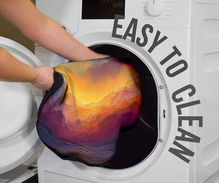 Colorful Universe Car Seat Cover being placed into a washing machine, highlighting that they are easy to clean.