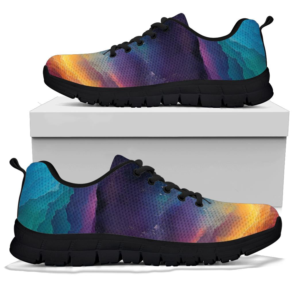A pair of Colorful Universe Sneakers with black soles and black laces, displayed resting on top of a plain white shoe box.