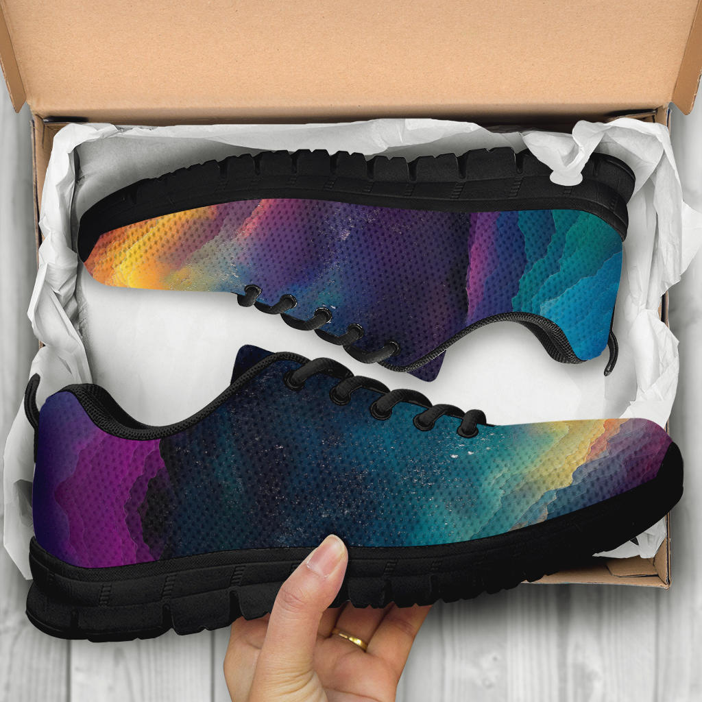 Unboxing Colorful Universe Sneakers with black soles, showing the galaxy-themed shoes held inside a cardboard shoe box.