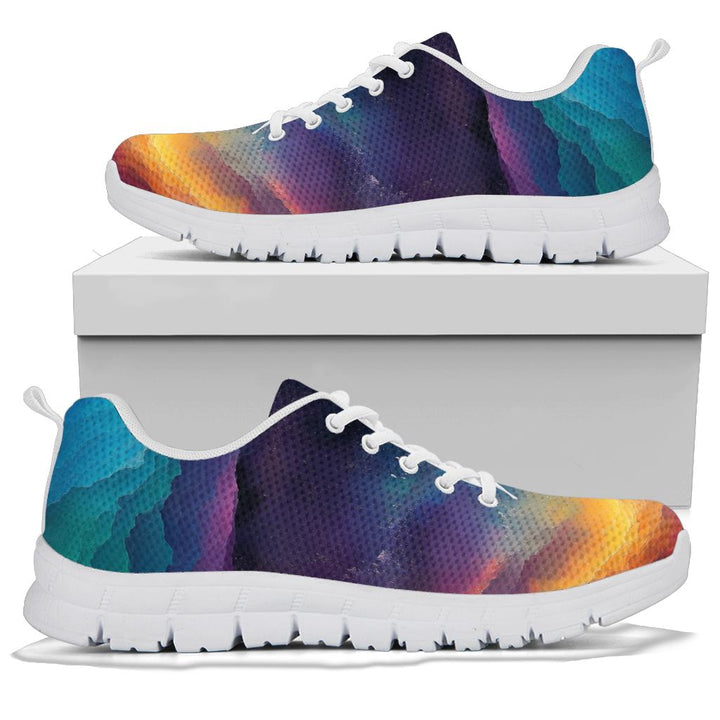 A pair of Colorful Universe Sneakers with white soles and white laces, displayed resting on top of a plain white shoe box.