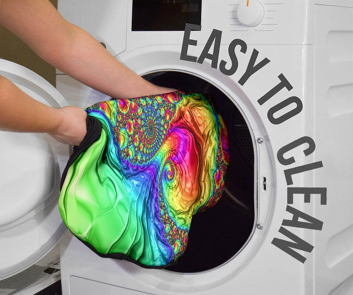 Happy Rainbow Car Seat Cover being placed into a washing machine, highlighting that they are easy to clean.