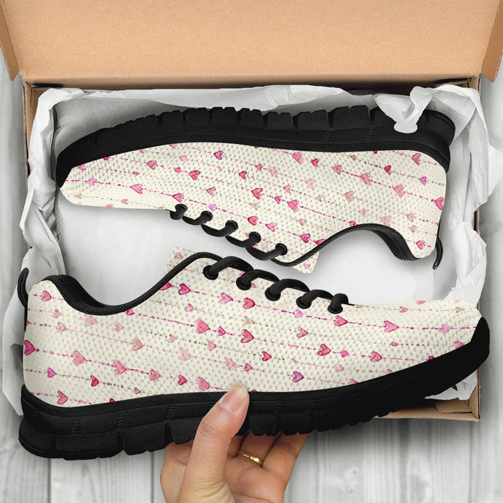 Unboxing Hearts Sneakers with black soles, showing the cute heart themed shoes inside a cardboard box.
