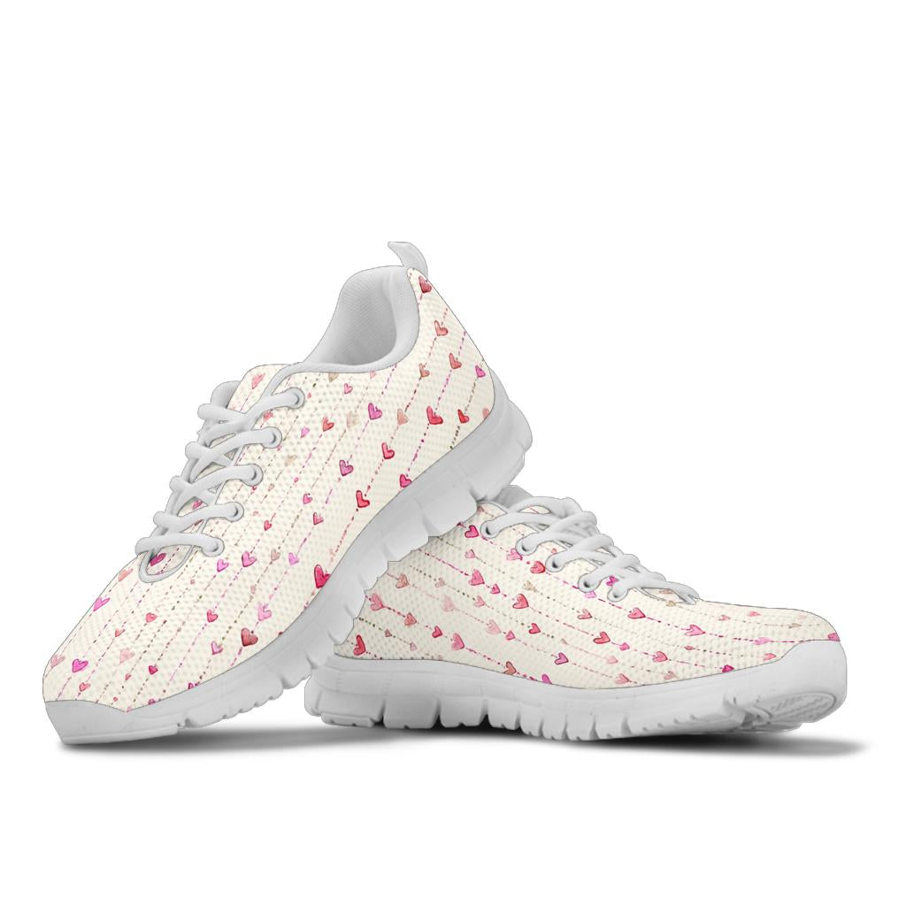 Stacked view of Hearts Sneakers showcasing the romantic delicate hearts pattern with crisp white soles and white laces.