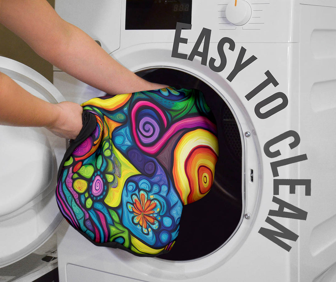 Hippie Vibes Car Seat Cover being placed into a washing machine, highlighting that they are easy to clean.