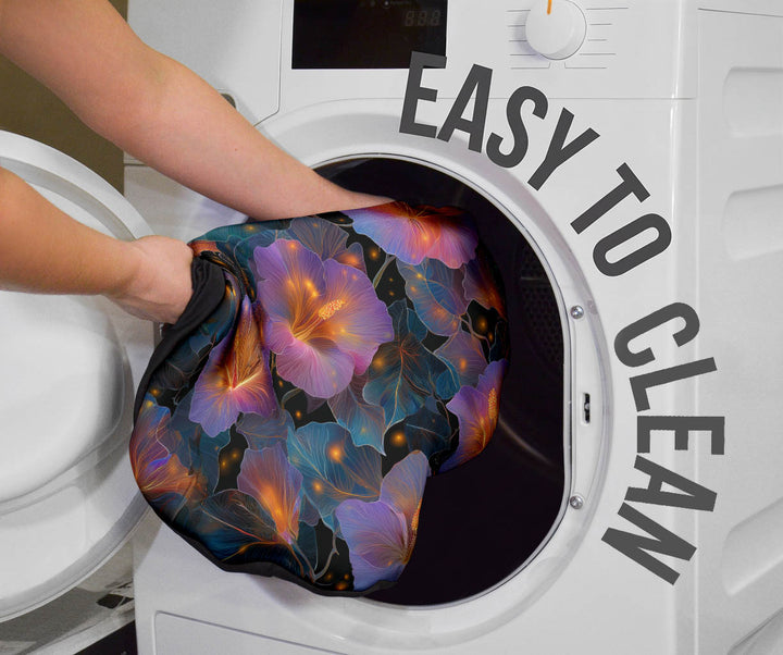 Kingfisher Car Seat Cover being placed into a washing machine, highlighting that they are easy to clean.