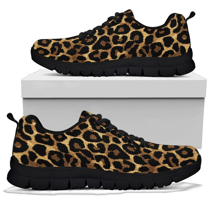 A pair of Leopard Sneakers with black soles and black laces, displayed resting on top of a plain white shoe box.