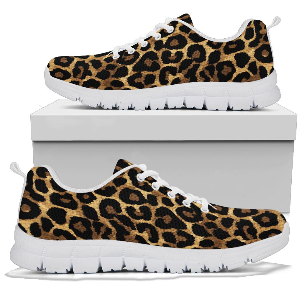 A pair of Leopard Sneakers with white soles and white laces, displayed resting on top of a plain white shoe box.