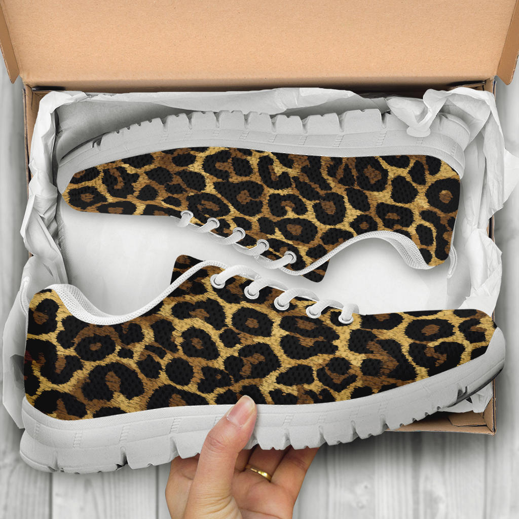 Unboxing Leopard Sneakers with white soles, showing the trendy patterned shoes inside a cardboard shoe box.