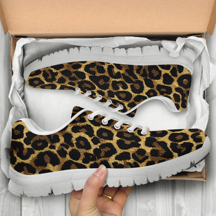 Unboxing Leopard Sneakers with white soles, showing the trendy patterned shoes inside a cardboard shoe box.