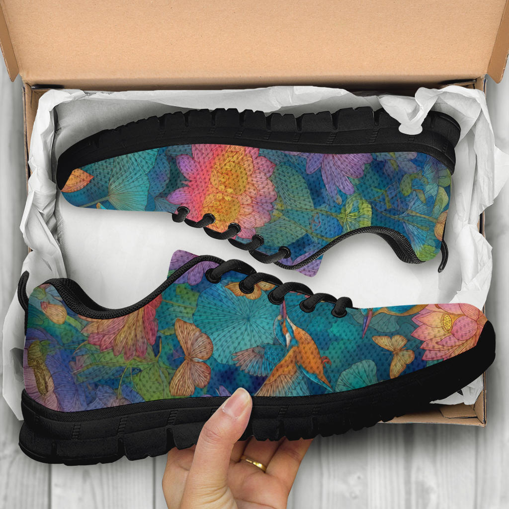 Unboxing Lotus Classic Sneakers with black soles, showing the colorful nature design inside a cardboard box.