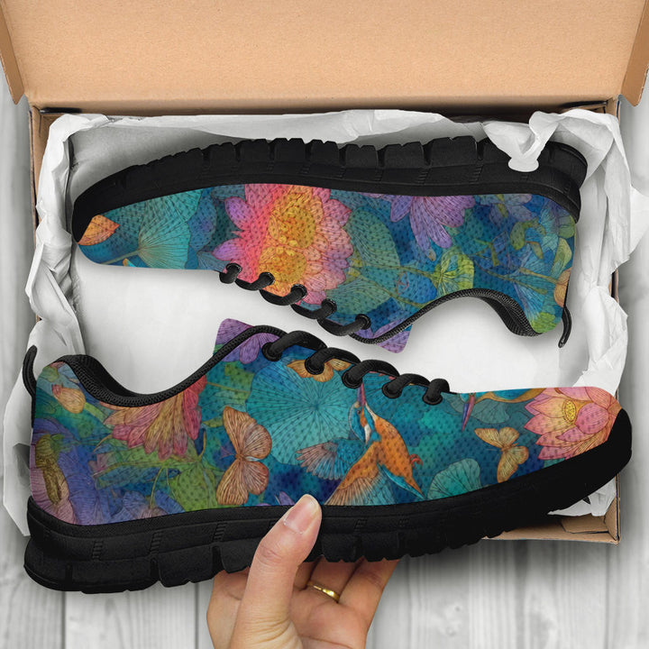 Unboxing Lotus Classic Sneakers with black soles, showing the colorful nature design inside a cardboard box.