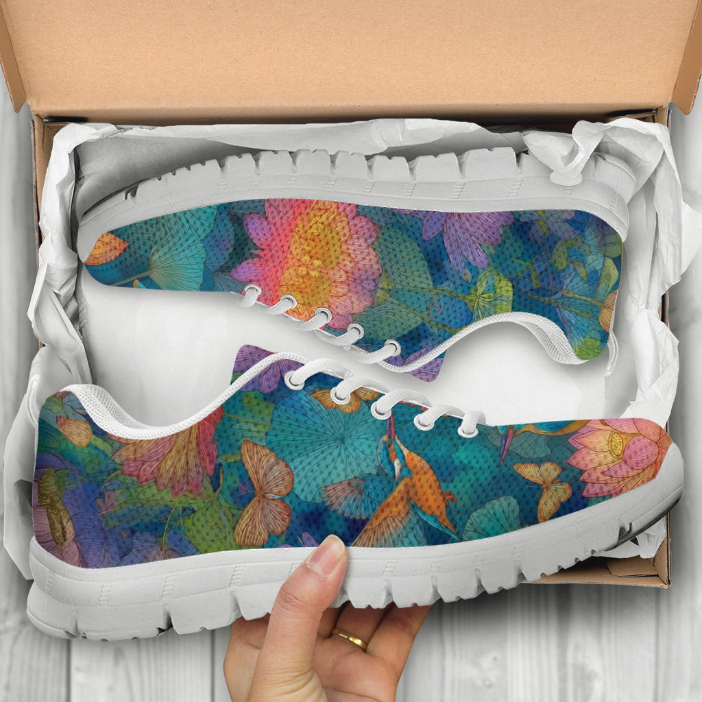 Unboxing Lotus Classic Sneakers with white soles, showing the artistically printed shoes inside the packaging.