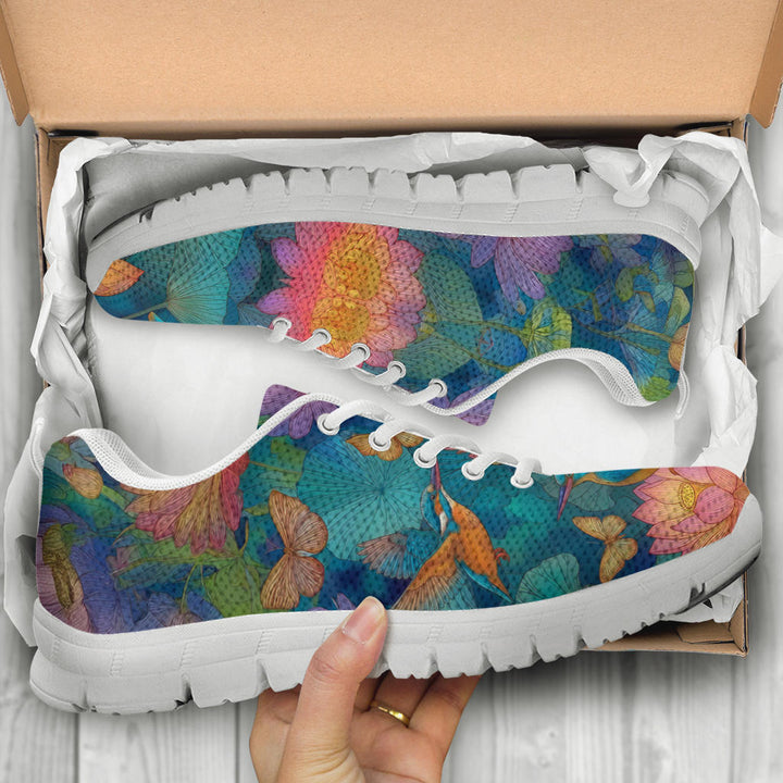 Unboxing Lotus Classic Sneakers with white soles, showing the artistically printed shoes inside the packaging.