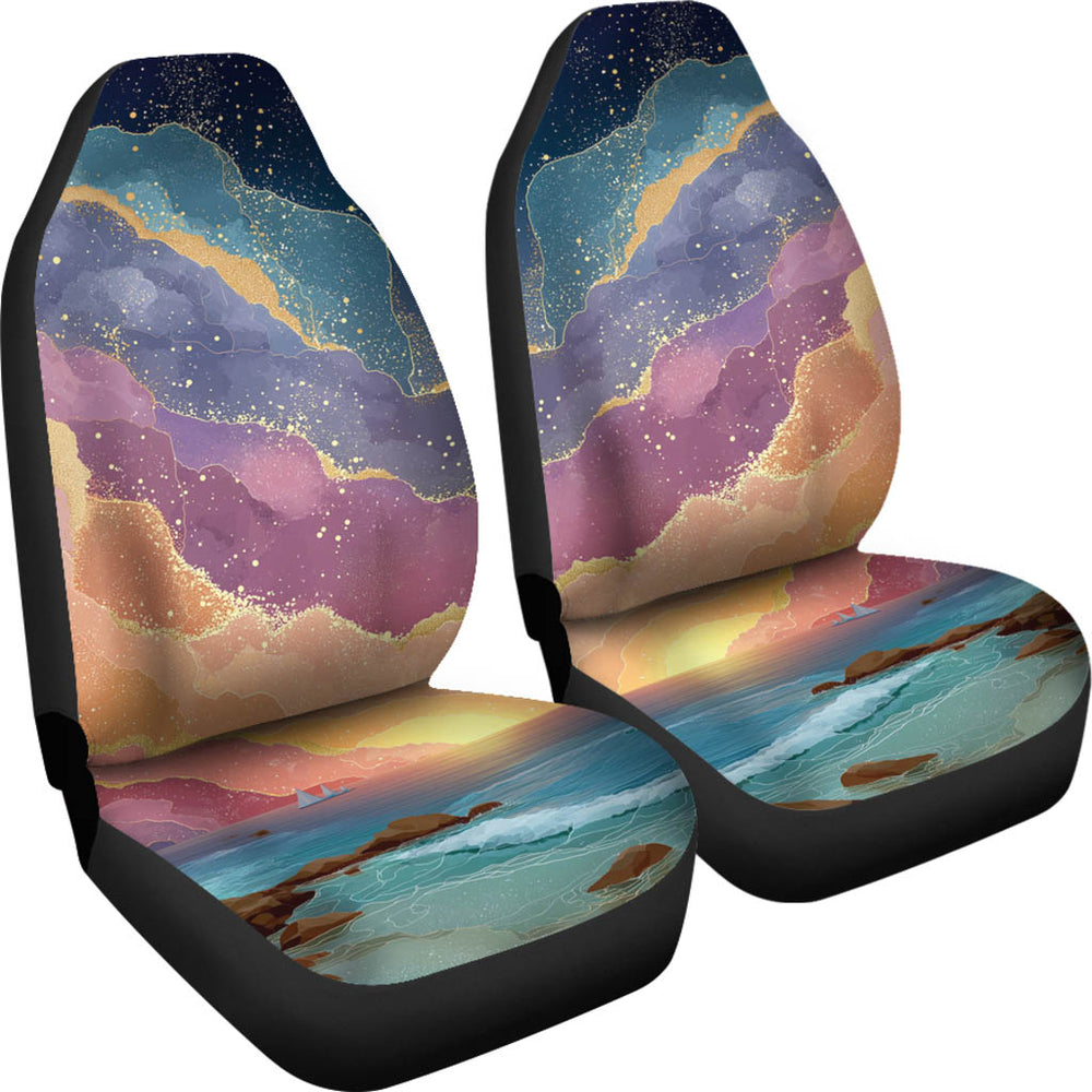 Angled view of a pair of Magical Sunset Car Seat Covers showcasing the beautiful starry sunset and beach design.