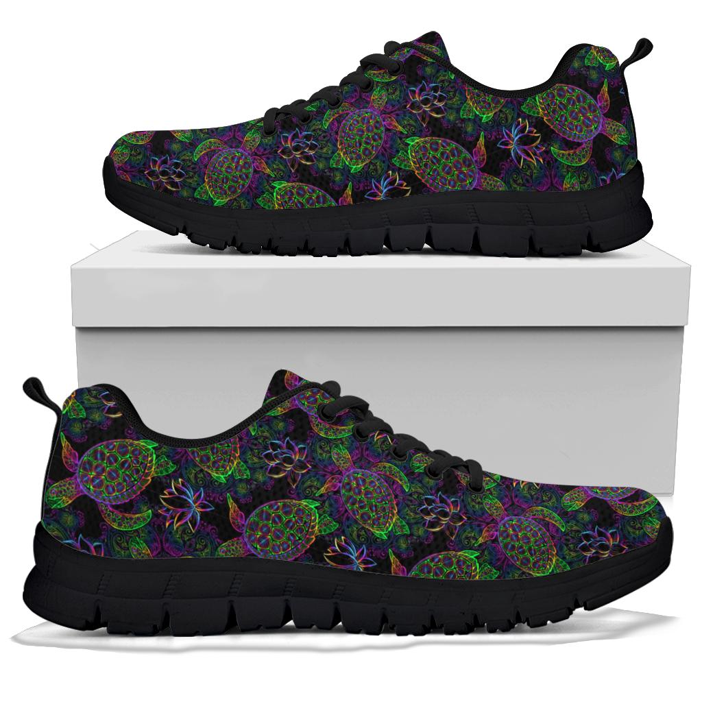 A pair of Sea Turtle Sneakers with black soles and black laces, displayed resting on top of a plain white shoe box.