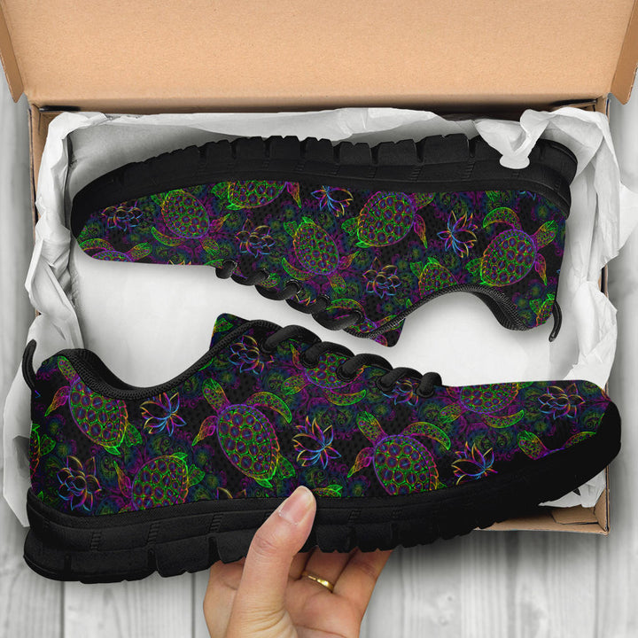 Unboxing Sea Turtle Sneakers with black soles, showing the ocean themed shoes inside a cardboard box.