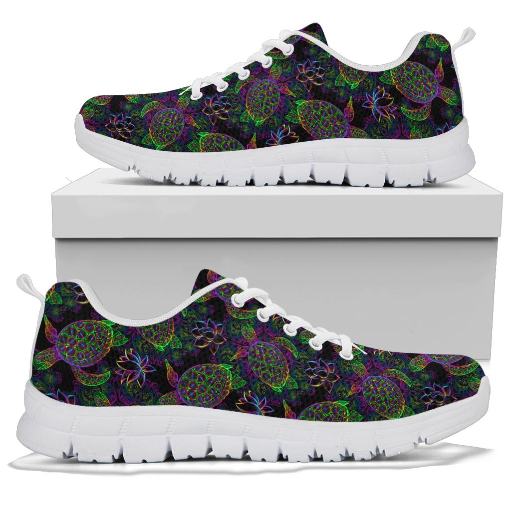 A pair of Sea Turtle Sneakers with white soles and white laces, displayed resting on top of a plain white shoe box.