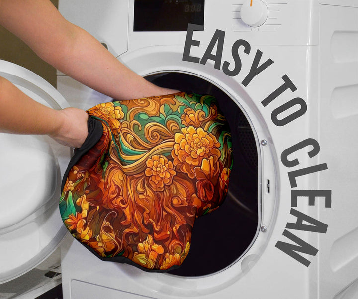 Shiva Car Seat Cover being placed into a washing machine, highlighting that they are easy to clean.