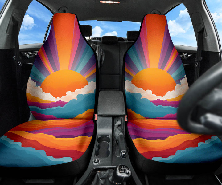 Front view of both Sunrise Car Seat Covers installed in a car, adding a colorful artistic touch to the interior.
