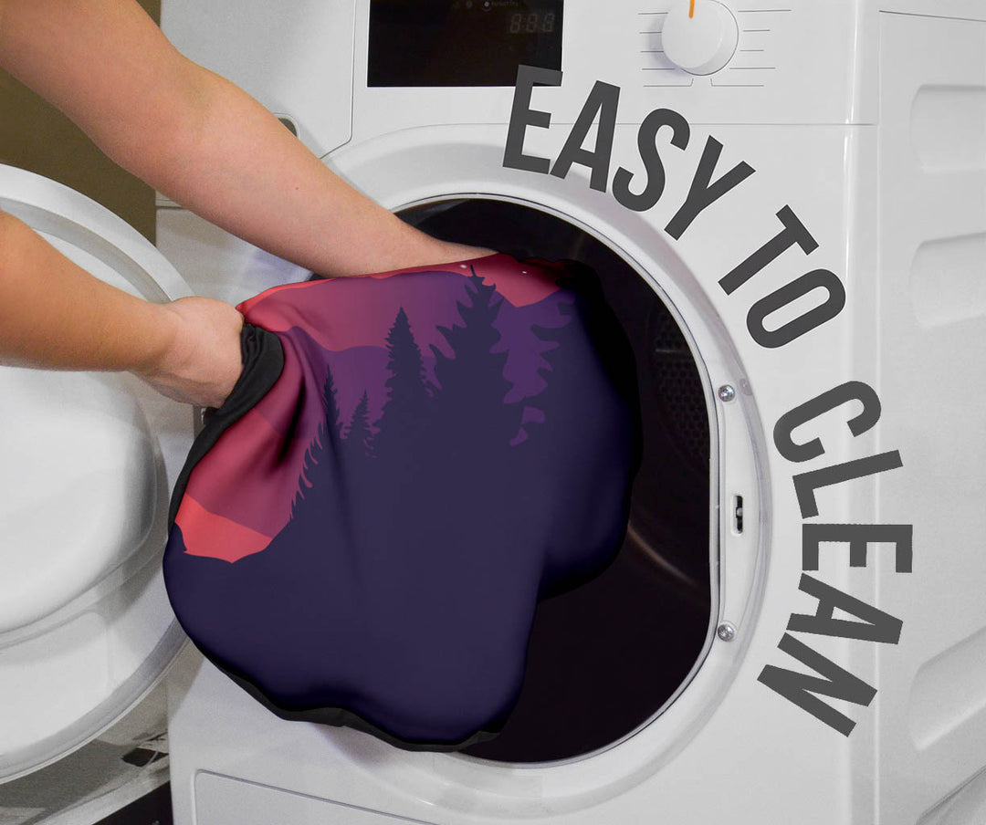 Wolves Car Seat Cover being placed into a washing machine, highlighting that they are easy to clean.