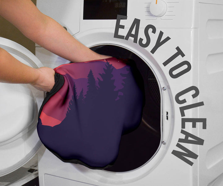 Wolves Car Seat Cover being placed into a washing machine, highlighting that they are easy to clean.